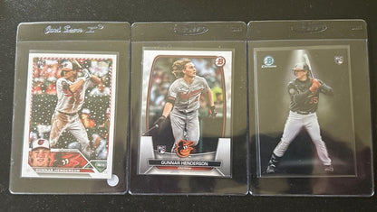 2023 Bowman Chrome Adley Rutschman #BS-4 Rookie Card, 2023 Bowman Gunnar Henderson #65 Rookie Card and 2023 Topps Holiday Gunnar Henderson #H4 Rookie Card Lot